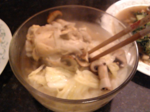 chinese thick noodles with chicken breast, cabbage, mushrooms